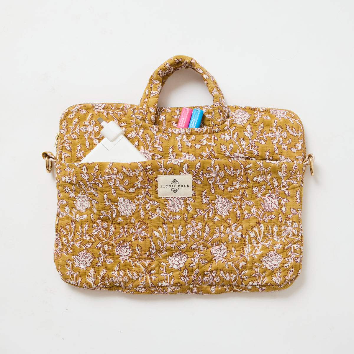 Handcrafted quilted laptop tote in Cinnamon by Picnic Folk. Removable shoulder strap and four pockets.