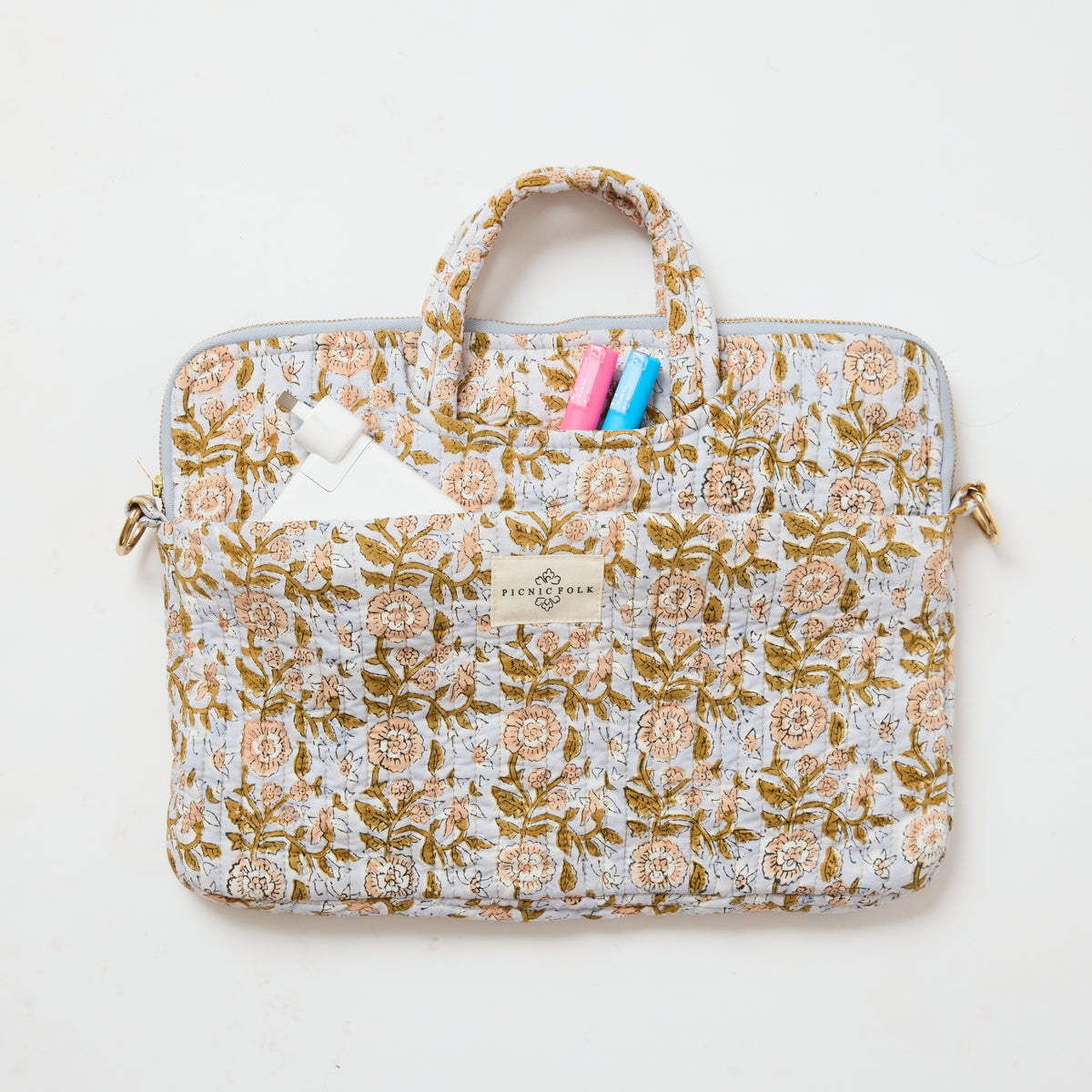 Handcrafted quilted laptop tote in Dahlia Blue by Picnic Folk. Removable shoulder strap and four pockets.