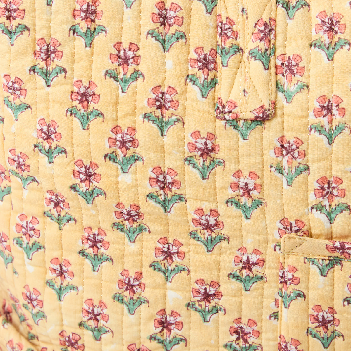 Quilted overnight duffel bag with apricot background and pink flower pattern by Picnic Folk.