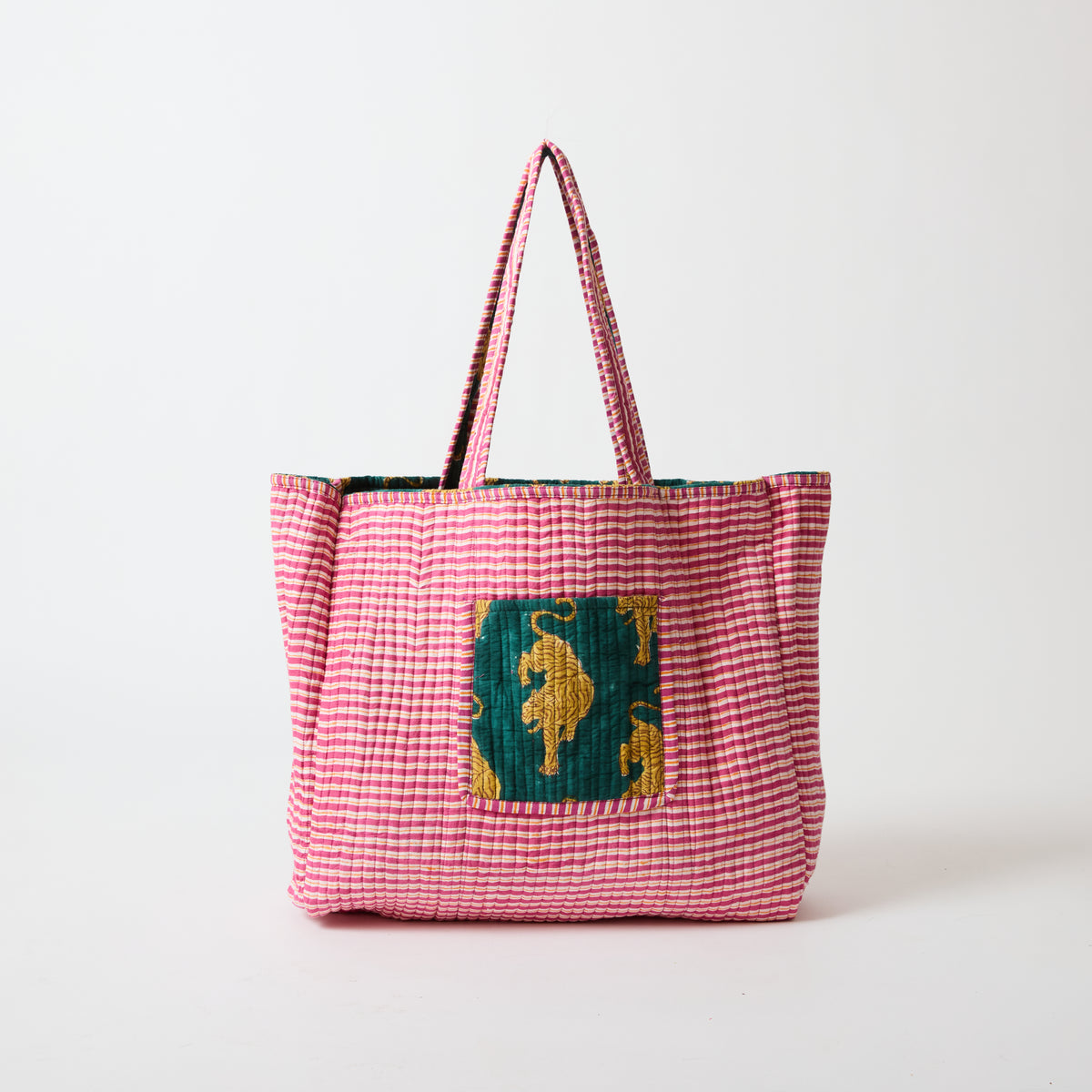 Reversible quilted tote bag shown in its red stripe reverse side by Picnic Folk.